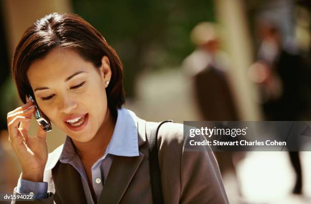 young business woman using a mobile phone - stewart stock-fotos und bilder