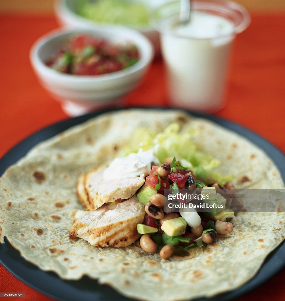 Tortilla Filled With Black Eyes Beans, Avocado and Grilled Chicken