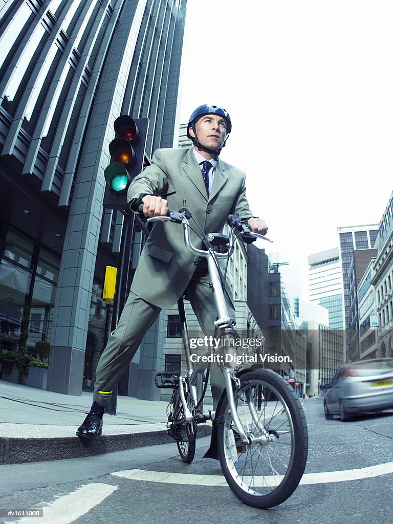 Businessman Riding a Bicycle