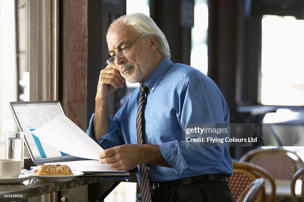 Businessman Working in a Cafe