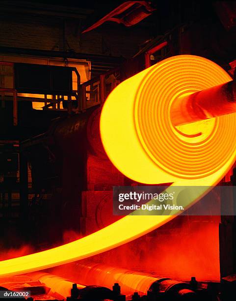 red-hot roll of steel in steel mill - steel mill stock pictures, royalty-free photos & images