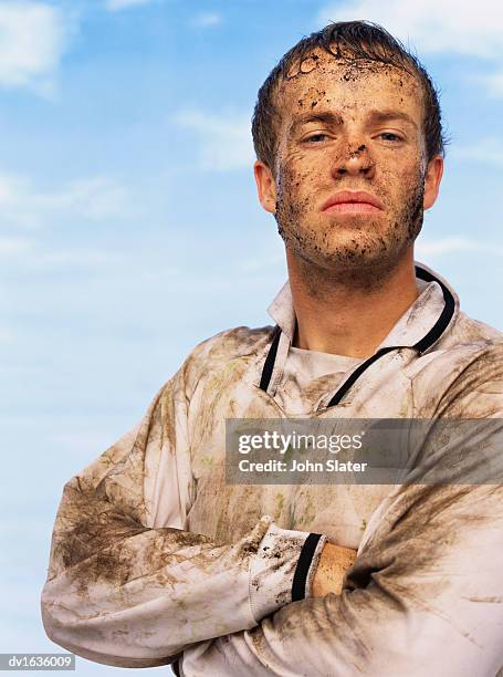 portrait of a sweaty football player covered in mud - football player imagens e fotografias de stock