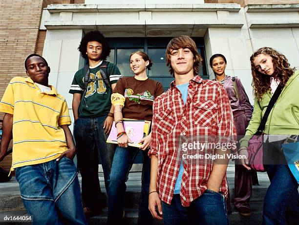 portrait of six cool looking young friends stood together - grupo de adolescentes - fotografias e filmes do acervo