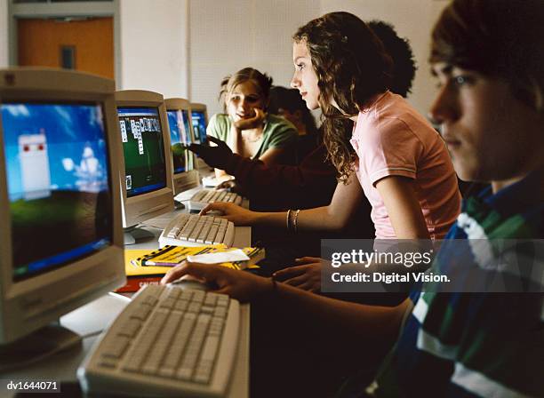 secondary school students playing computer games - secondary stock pictures, royalty-free photos & images