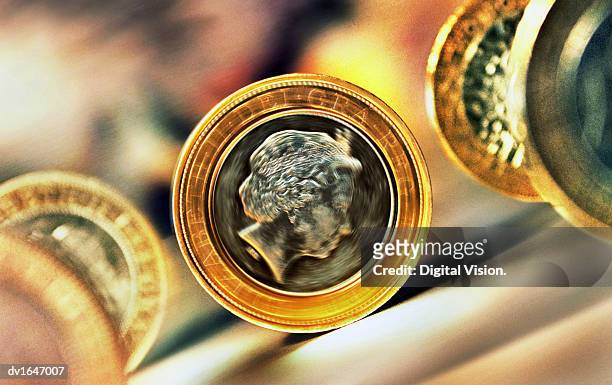 close-up of five rolling two pound coins - two pound coin stock pictures, royalty-free photos & images