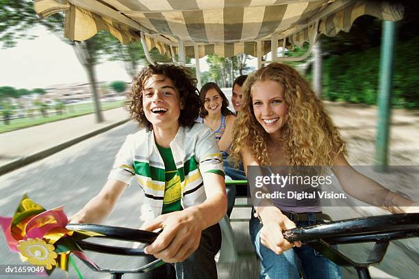 teenage boys and girls cycling with their friends in a rickshaw - gyroscope stock pictures, royalty-free photos & images