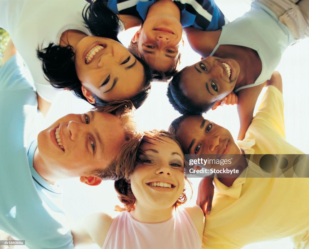 Group of teenagers in huddle