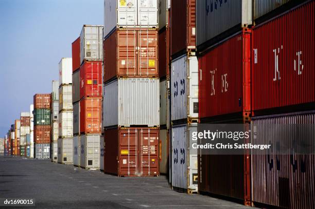 stacked lines of cargo containers at a docks - chris sattlberger stock pictures, royalty-free photos & images