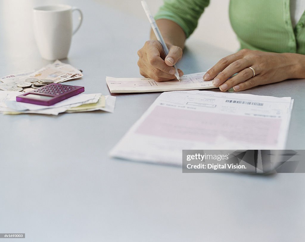 Woman Writing a Cheque
