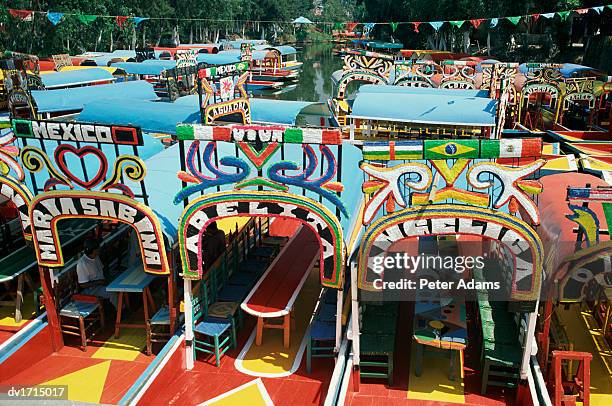 colourful trajineras (gondolas), mexico city, mexico - chinampas stock pictures, royalty-free photos & images
