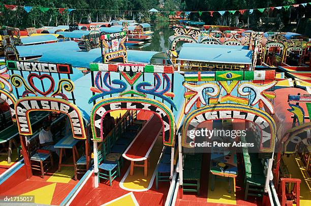 colourful trajineras (gondolas), mexico city, mexico - trajinera stock pictures, royalty-free photos & images