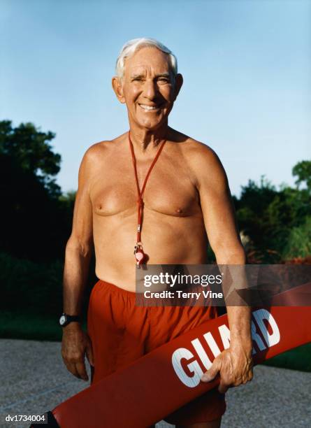 Senior Man Dressed As A Life Guard High-Res Stock Photo