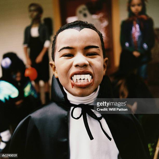 portrait of a boy wearing a vampire costume - square neckline stockfoto's en -beelden