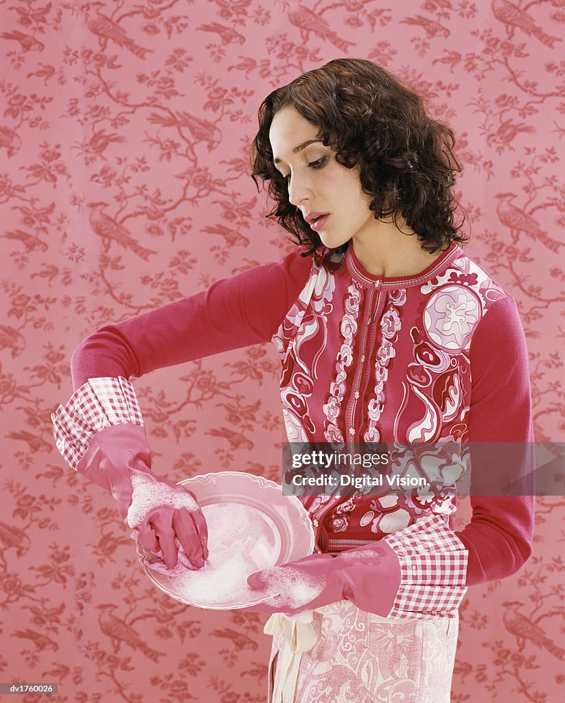 Obsessive Woman Washing a Plate