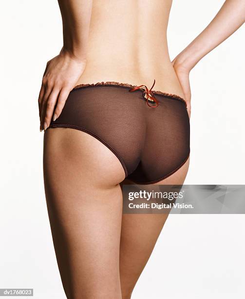 rear view of a woman wearing knickers - see through knickers photos et images de collection