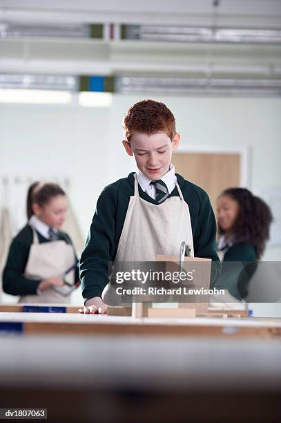 secondary school students in a woodwork class - secondary stock pictures, royalty-free photos & images