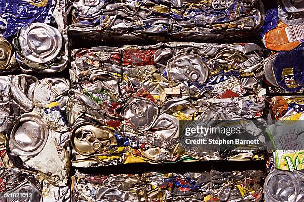 full frame close-up of crushed cans for recycling - compacted stock pictures, royalty-free photos & images
