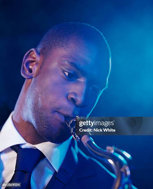 man playing a saxophone - soloist stock pictures, royalty-free photos & images
