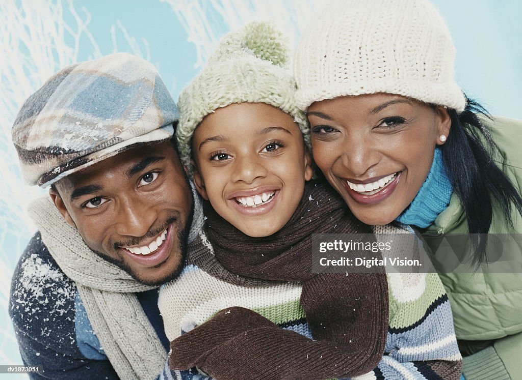 Portrait of Parents With Their Son Wearing Winter Clothing
