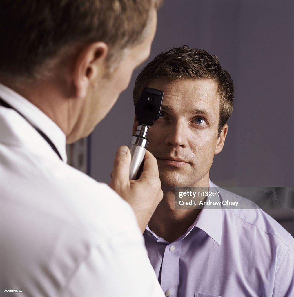 Doctor Examining a Patient's Eye with a Strabismoscope