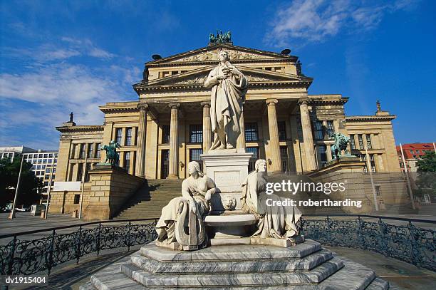 statue of friedrich schiller and the schauspielhaus, gendarmenmarkt, berlin, germany - gendarmenmarkt stock pictures, royalty-free photos & images