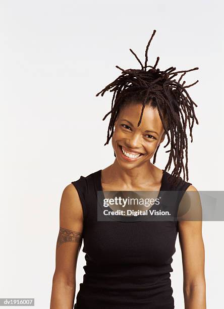 portrait of a smiling woman with dreadlocks - dreadlocks stock pictures, royalty-free photos & images