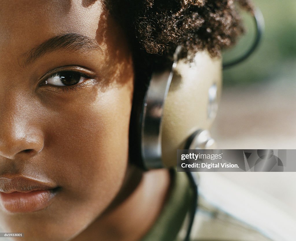 Close Up Portrait of a Young Woman Wearing Headphones