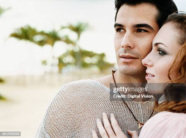 romantic twentysomething couple standing on a paradise beach - paradise bildbanksfoton och bilder