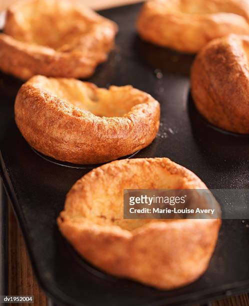 yorkshire puddings in a baking tray - avery stock pictures, royalty-free photos & images