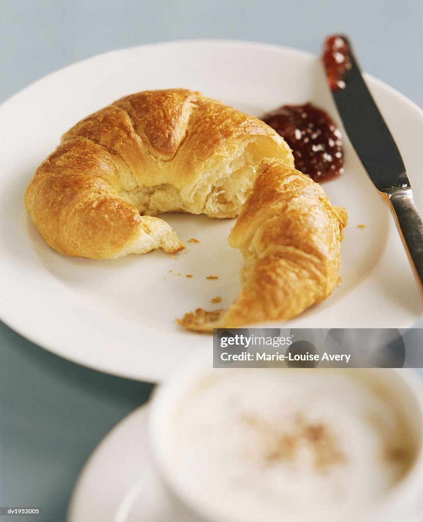 Croissant on a Plate With Jam