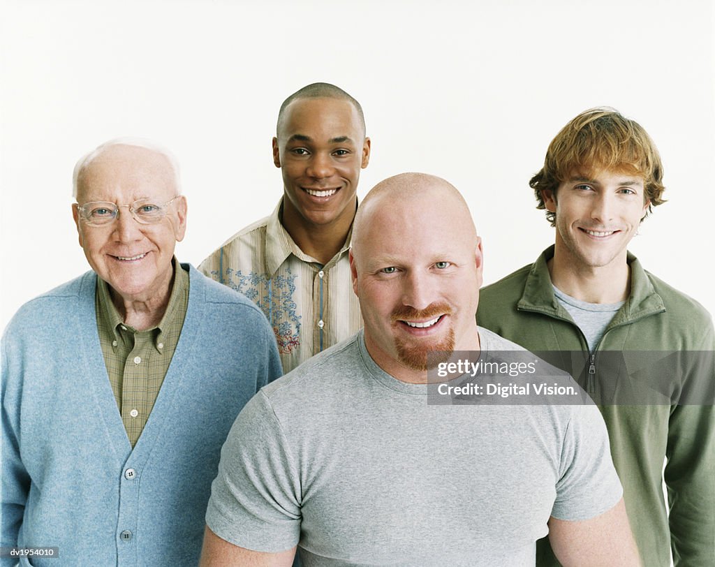 Studio Portrait of Four Smiling Men of Mixed Ages