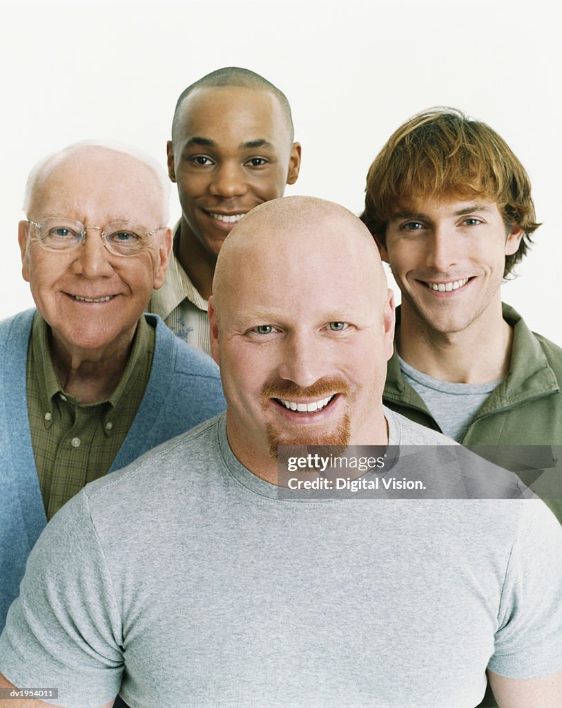 Studio Portrait of Four Smiling Men of Mixed Ages