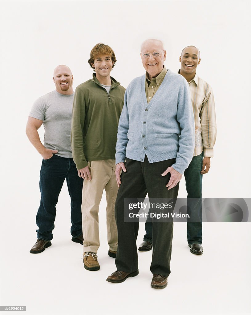 Full Length Studio Portrait of Four Smiling Men of Mixed Ages