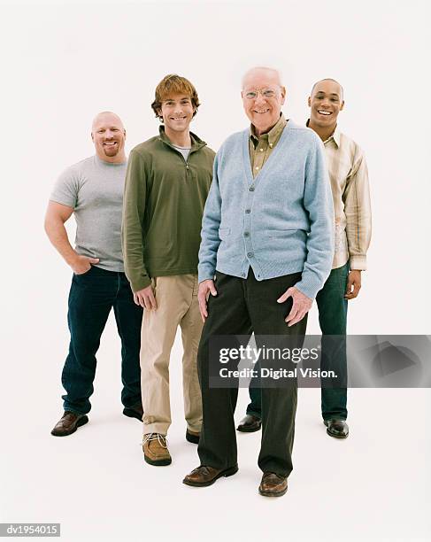 full length studio portrait of four smiling men of mixed ages - completamente calvo - fotografias e filmes do acervo