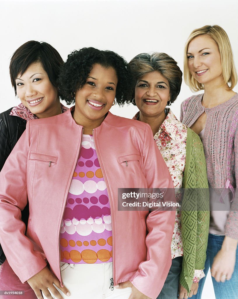 Studio Shot of a Mixed Age, Multiethnic Group of Laughing Women