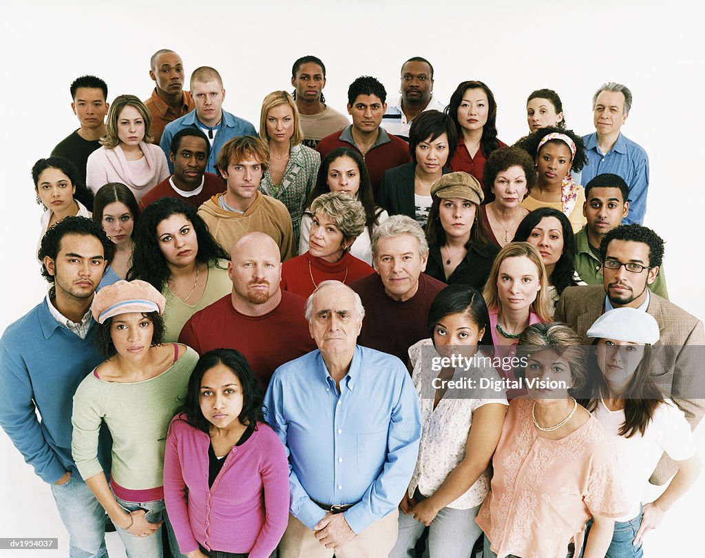 Studio Shot of a Large Mixed Age, Multiethnic Group of Men and Women Staring at the Camera in a Displeased Way