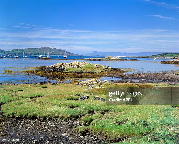 view of the isle of eigg from arisaig, south morar, scotland - ハイランド諸島 ストックフォトと画像