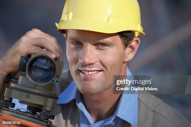 portrait of a surveyor with a theodolite - geodesy stock pictures, royalty-free photos & images