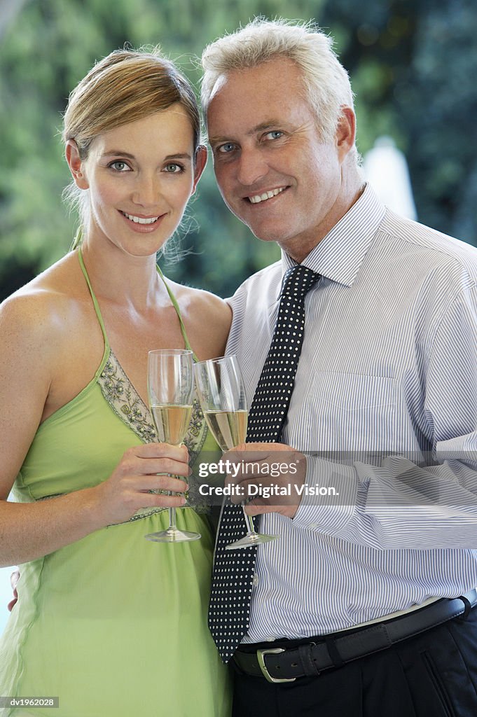 Couple Holding Champagne Flutes