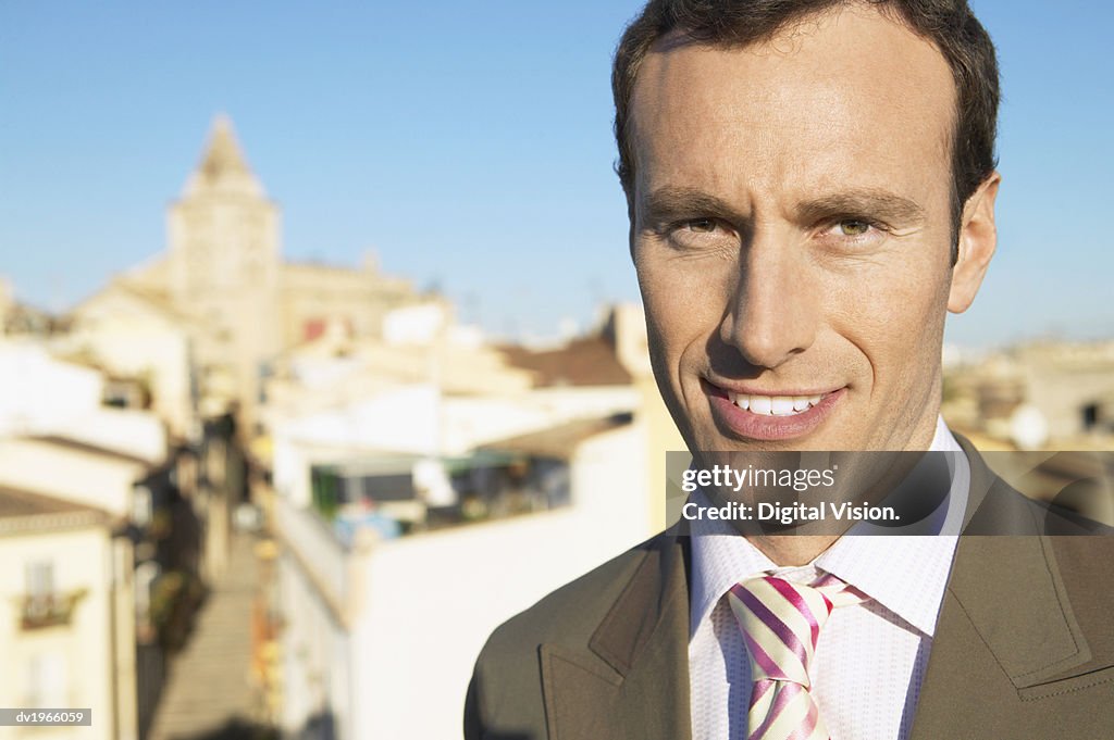 Portrait of a Businessman With a Cityscape in the Background