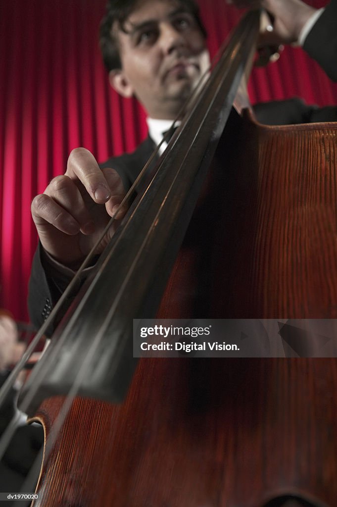 Low Angle View of a Male Cellist
