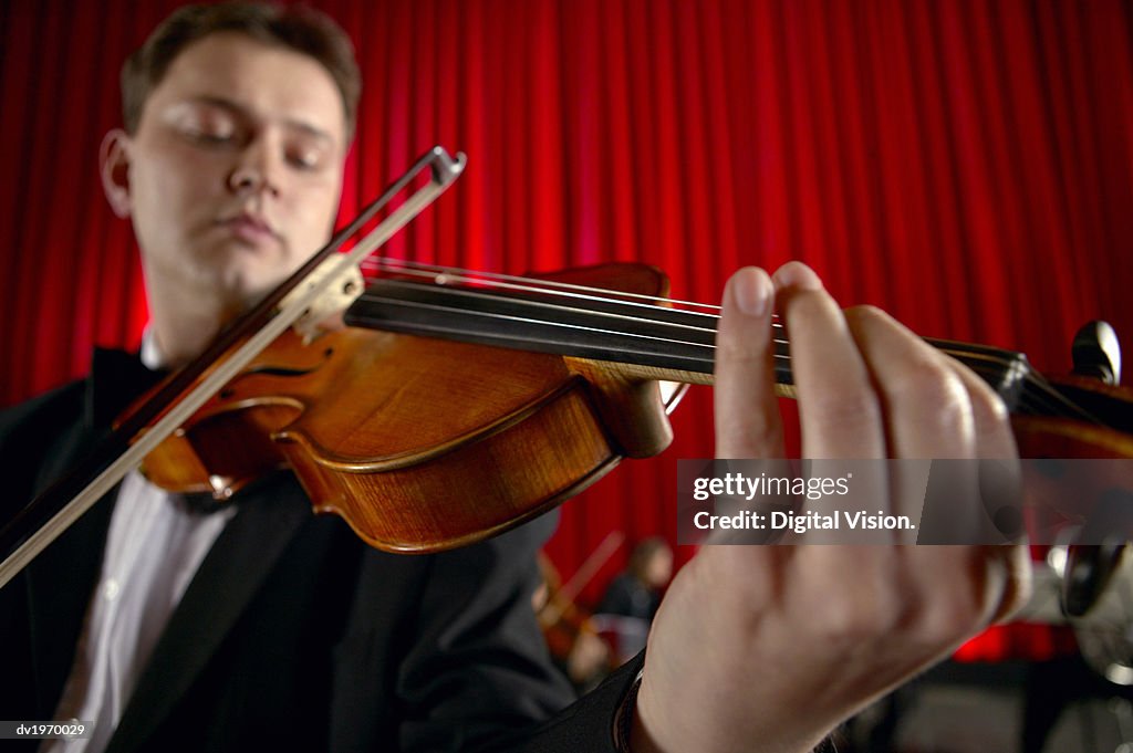 Close-Up of a Male Violinist Performing