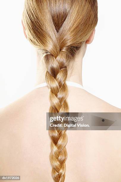 young woman with a long ponytail - blonde hair rear white background stock pictures, royalty-free photos & images