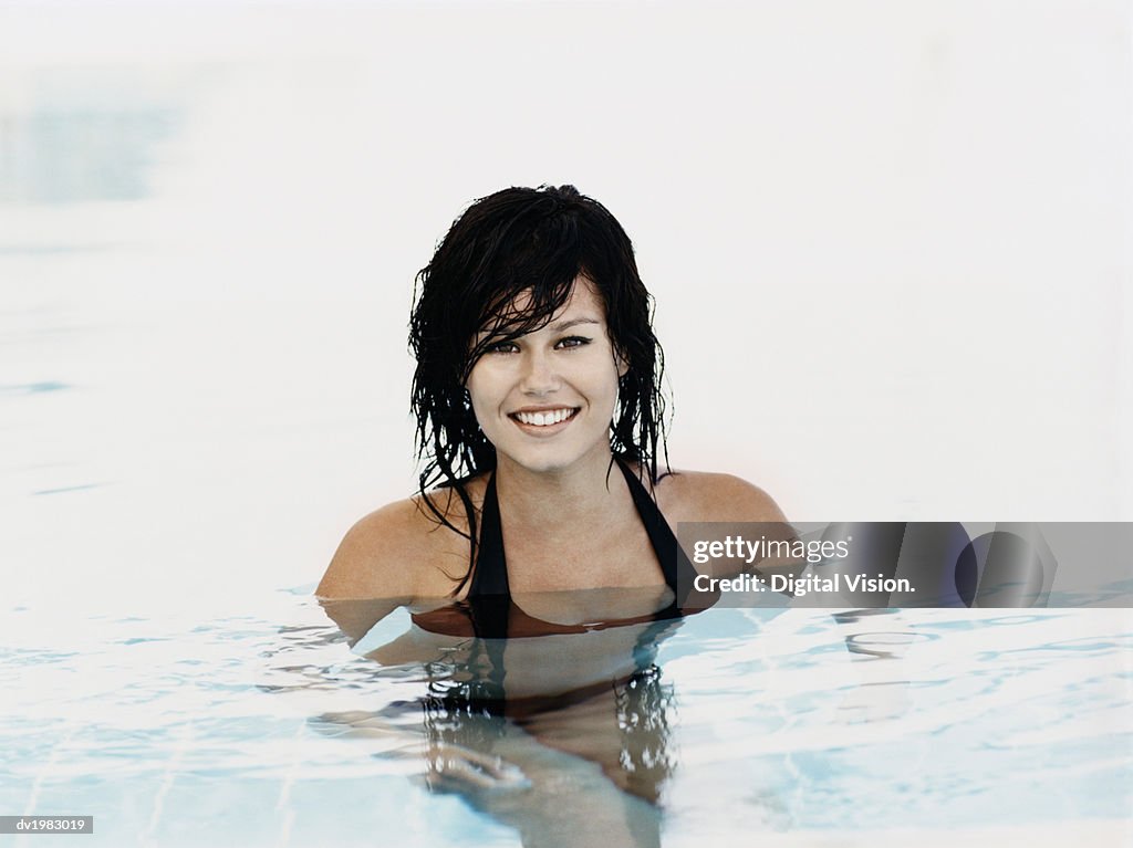 Portrait of a Young Woman Standing in a Swimming Pool