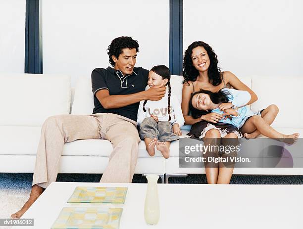 portrait of a family on a sofa - digital twin bildbanksfoton och bilder