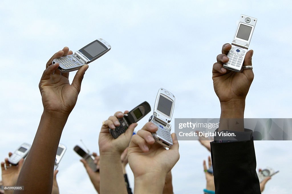 Mobile Phones Being Held in the Air