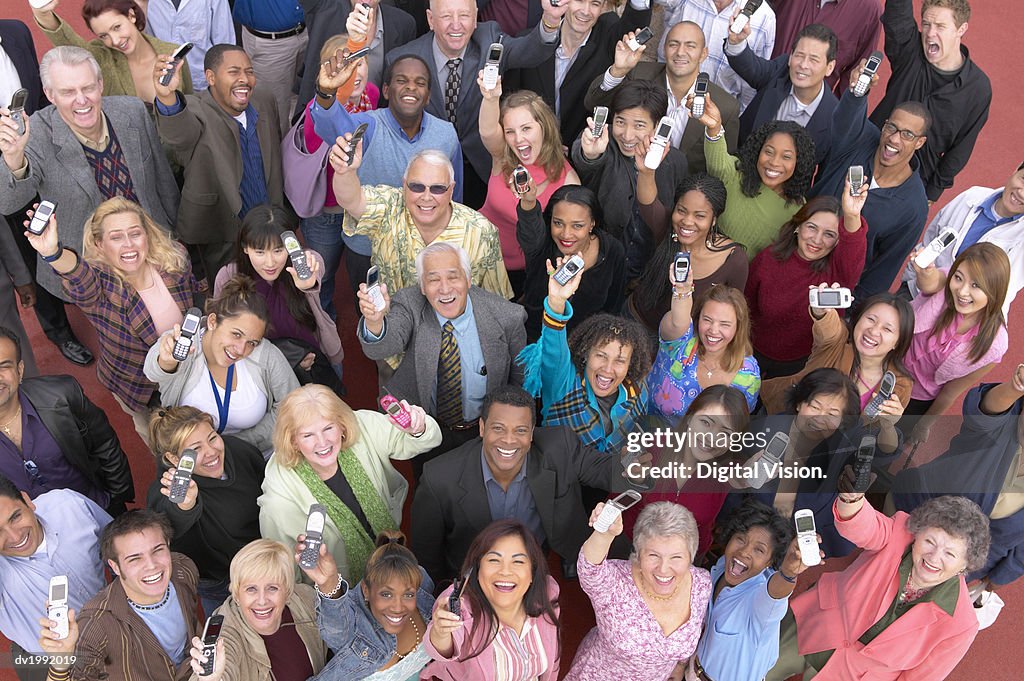 Crowd of People Showing Their Mobile Phones