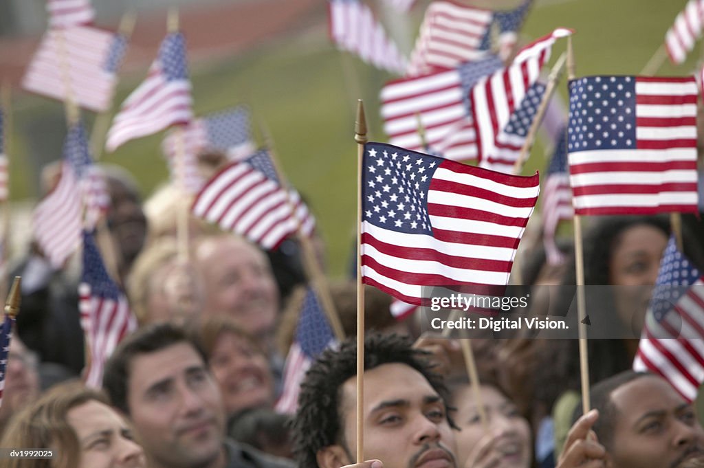 Crowd Waving Stars and Stripes Flags