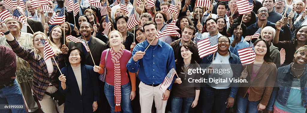 Large Crowd of People Holding Stars and Stripes Flags