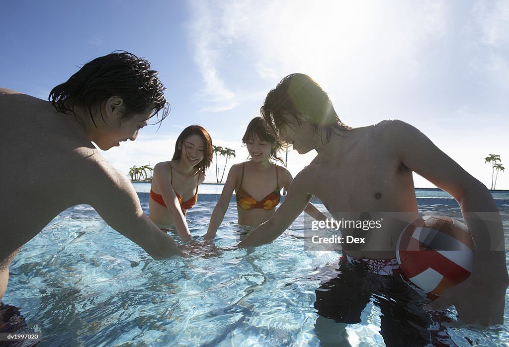 Four Friends Playing in a Swimming Pool